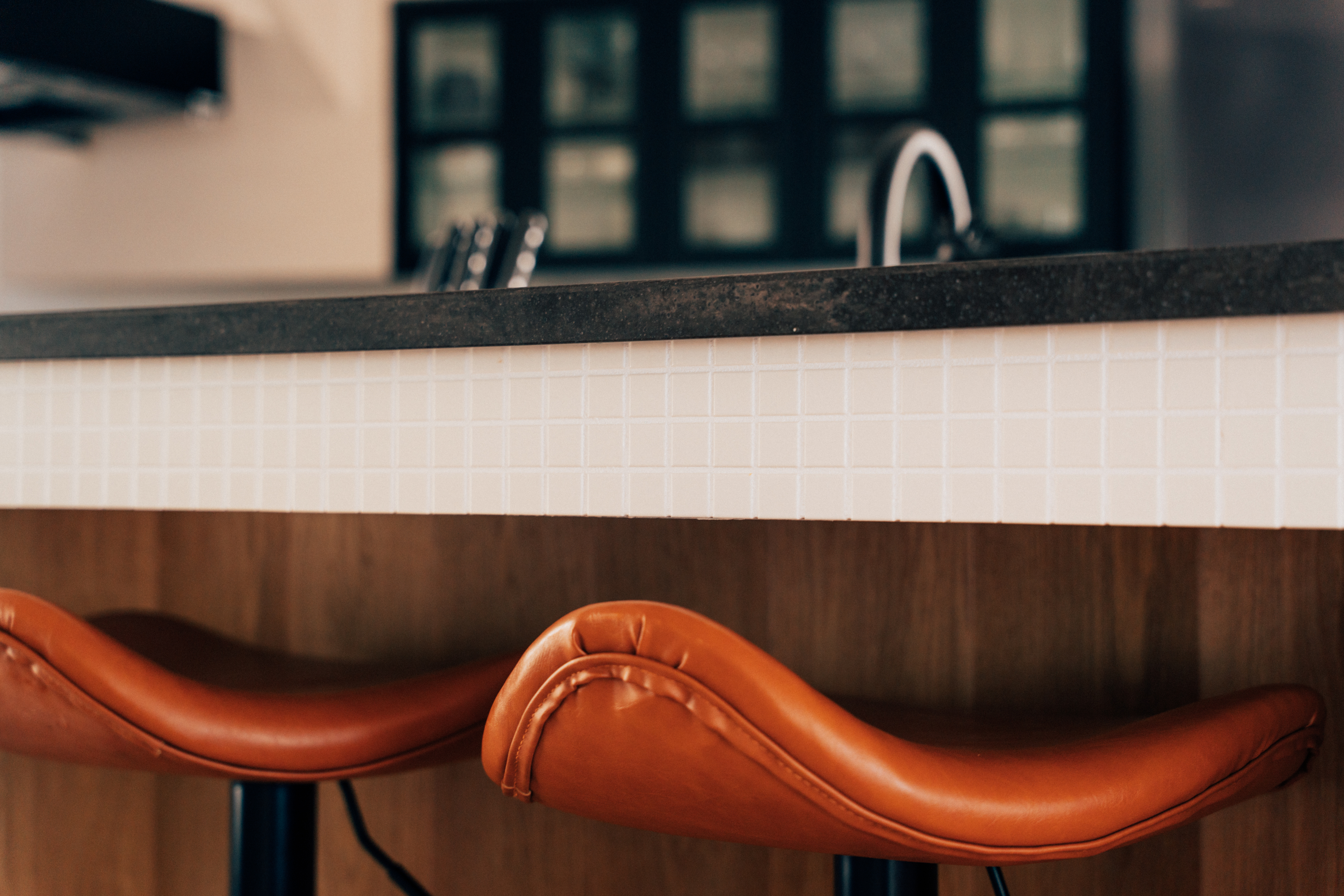 Leather stools at the kitchen bar in One Shibuya Hill