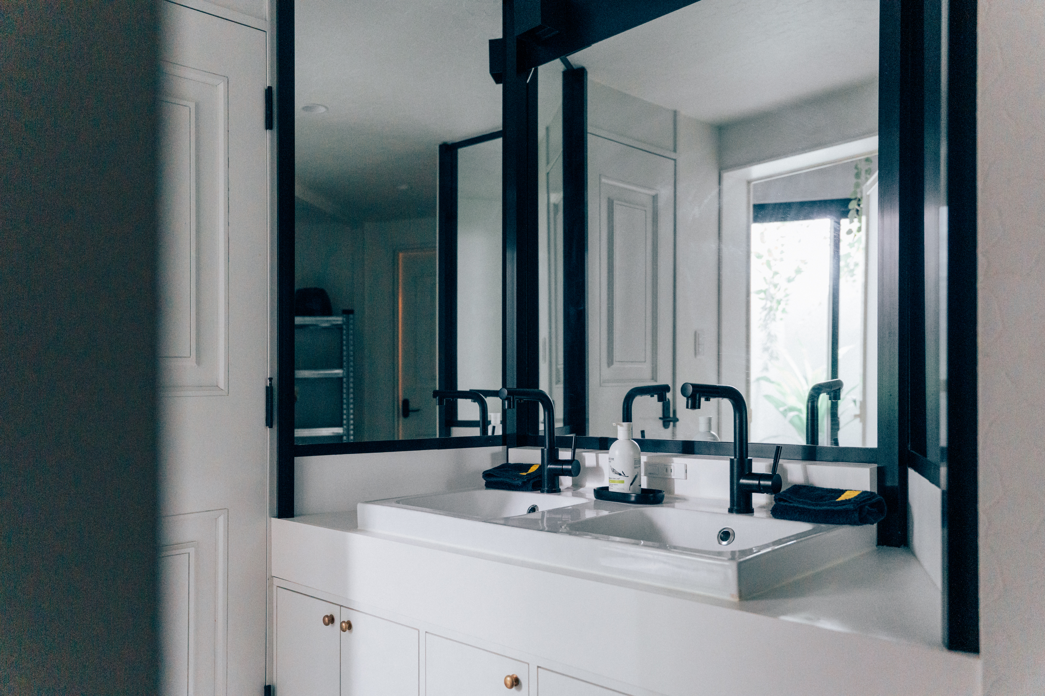 Double vanity and mirrors in a bathroom at One Shibuya Hill