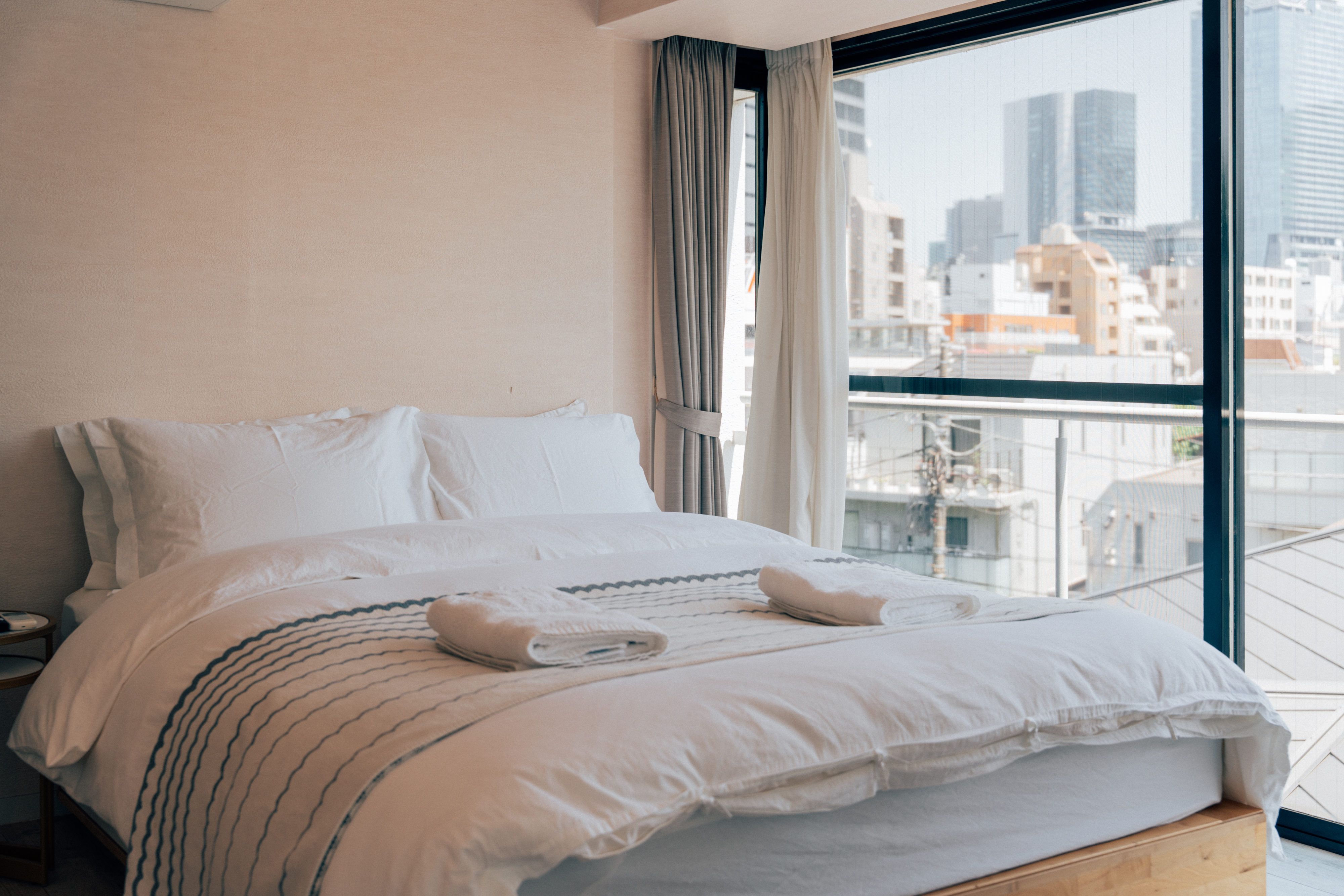 Bright bedroom with city views at One Shibuya Hill